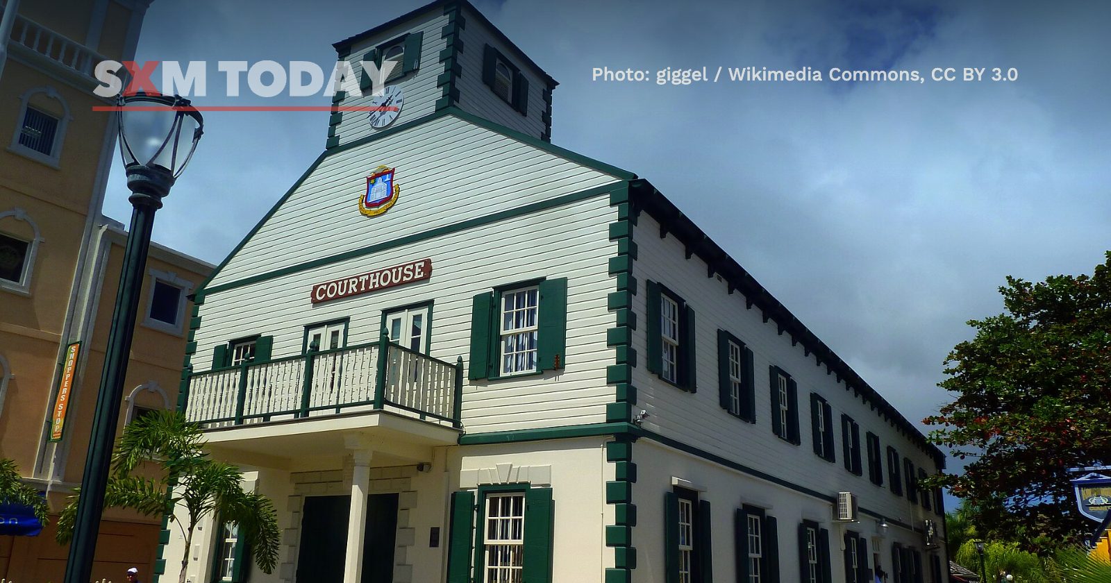 The historic Courthouse in Philipsburg, a white wooden building with green shutters and a clock tower.
