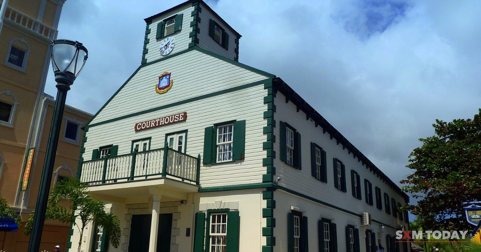 The historic Courthouse in Philipsburg, a white wooden building with green shutters and a clock tower.