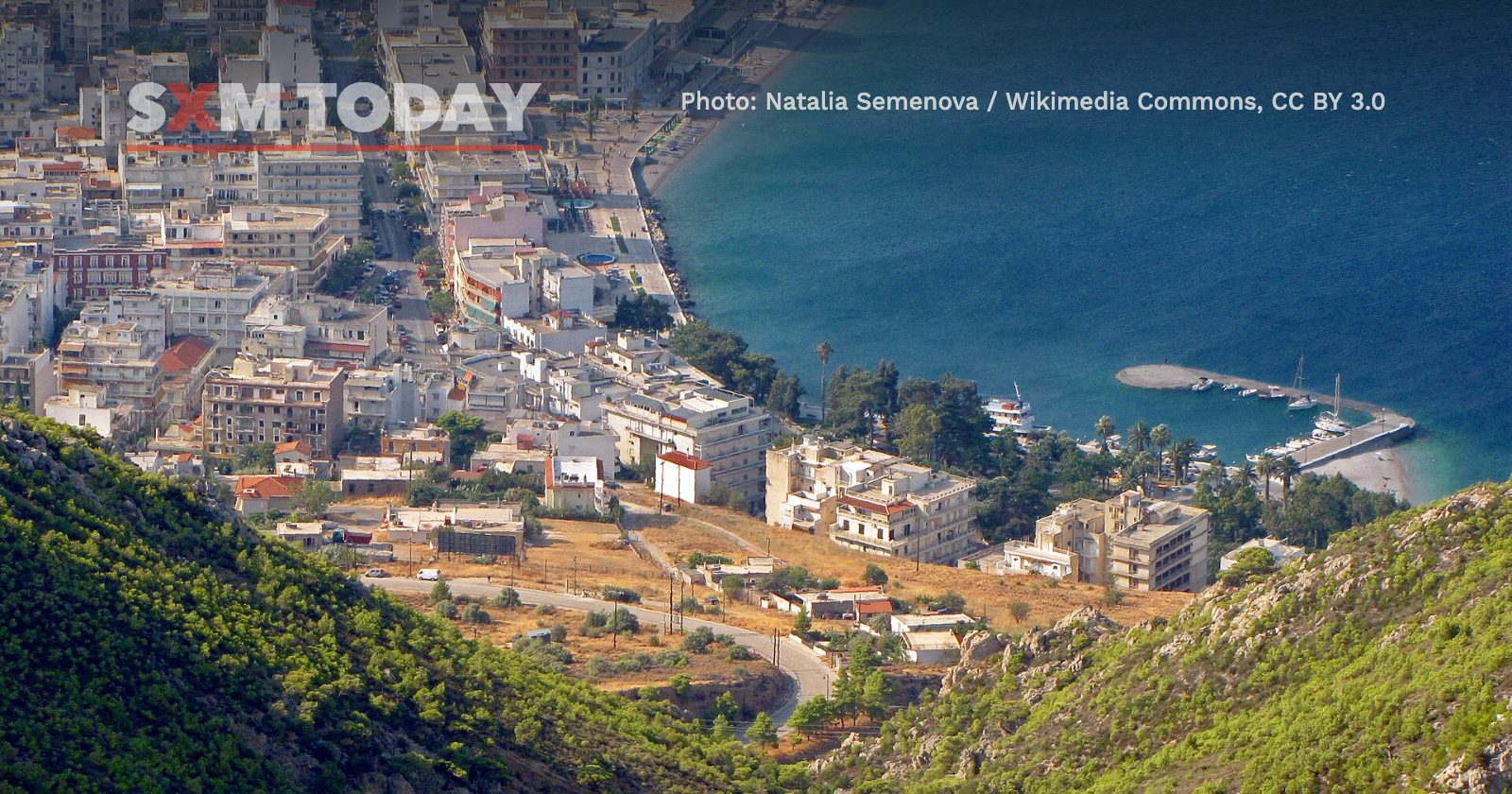 Loutraki, Greece, seen from the hills, its streets running down to the Gulf of Corinth.