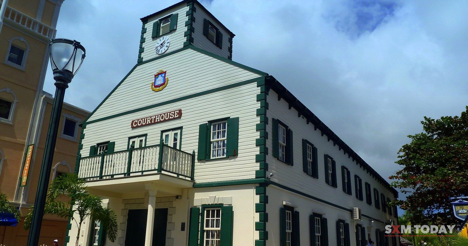 The historic Courthouse in Philipsburg, a white wooden building with green shutters and a clock tower.