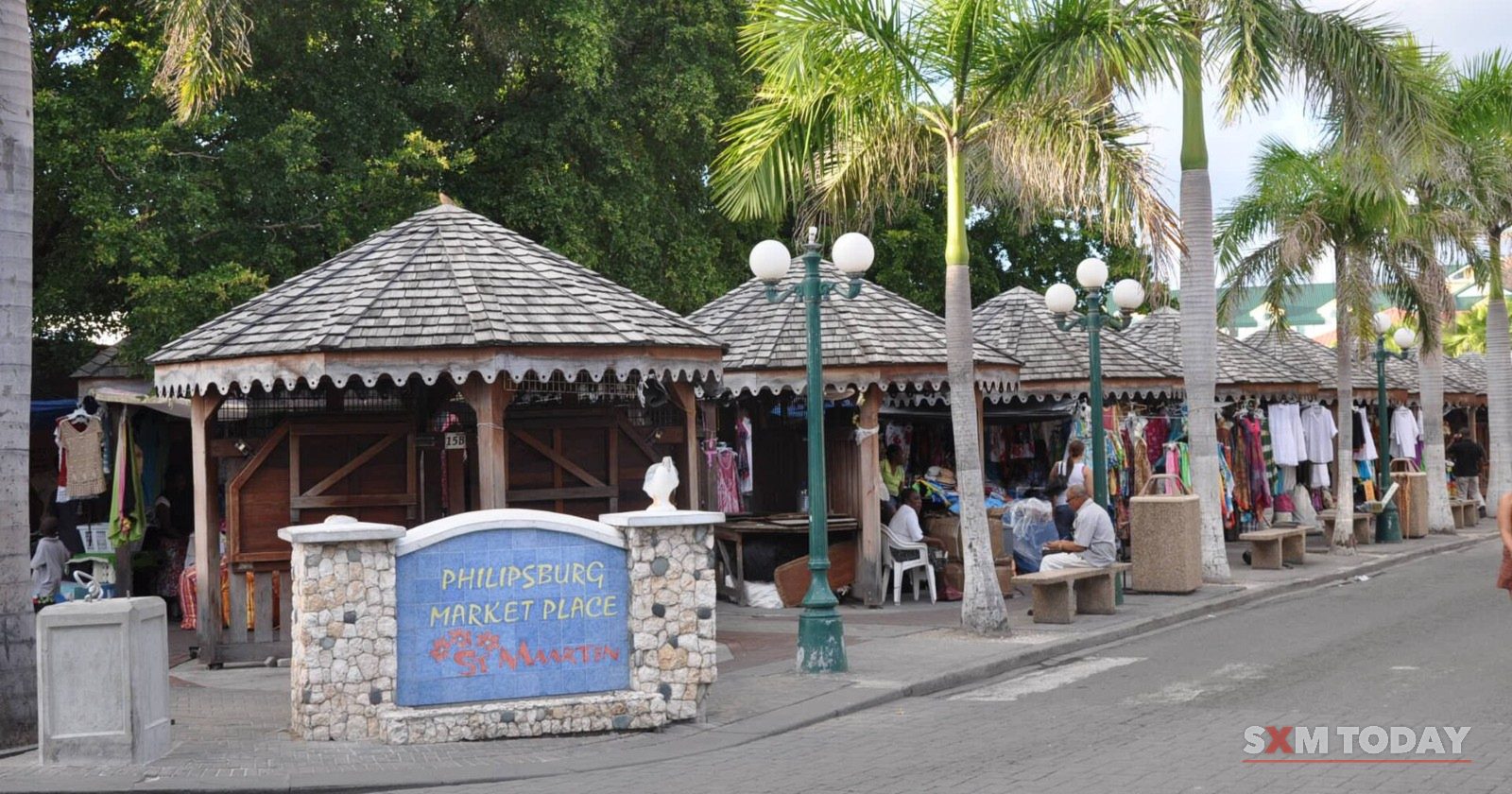 Vendors' stalls under peaked wooden roofs at the Philipsburg tourist market.
