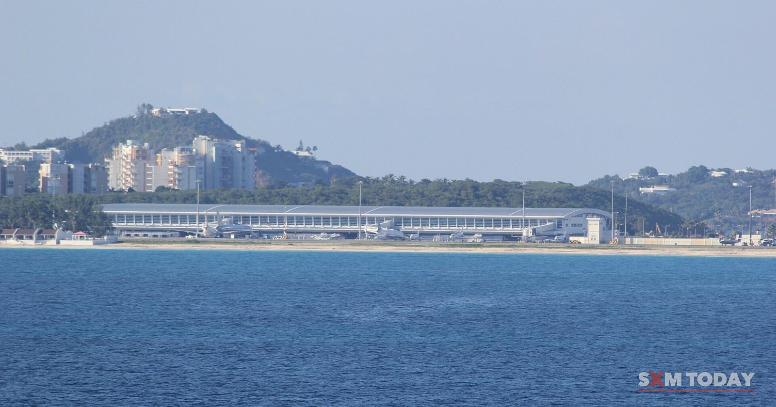 The terminal of Princess Juliana International Airport seen across the water of Simpson Bay.